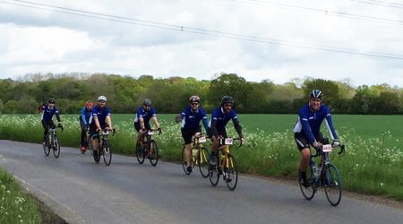 EBM Cycling Team Riding Along Road