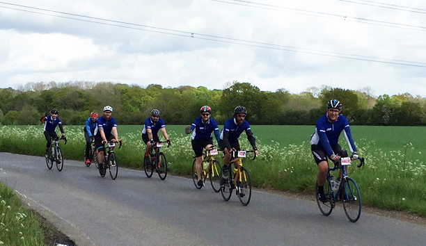 EBM Cycling Team Riding Along Road