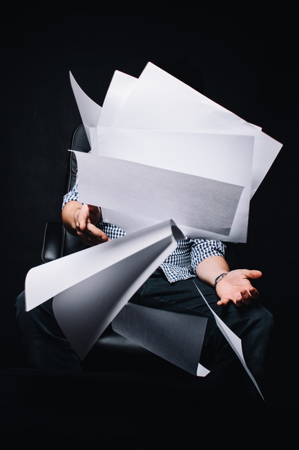 Paper Waste, Person Carrying Large Piles of Paper