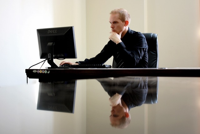 Outsourced IT - Man Sitting at Computer