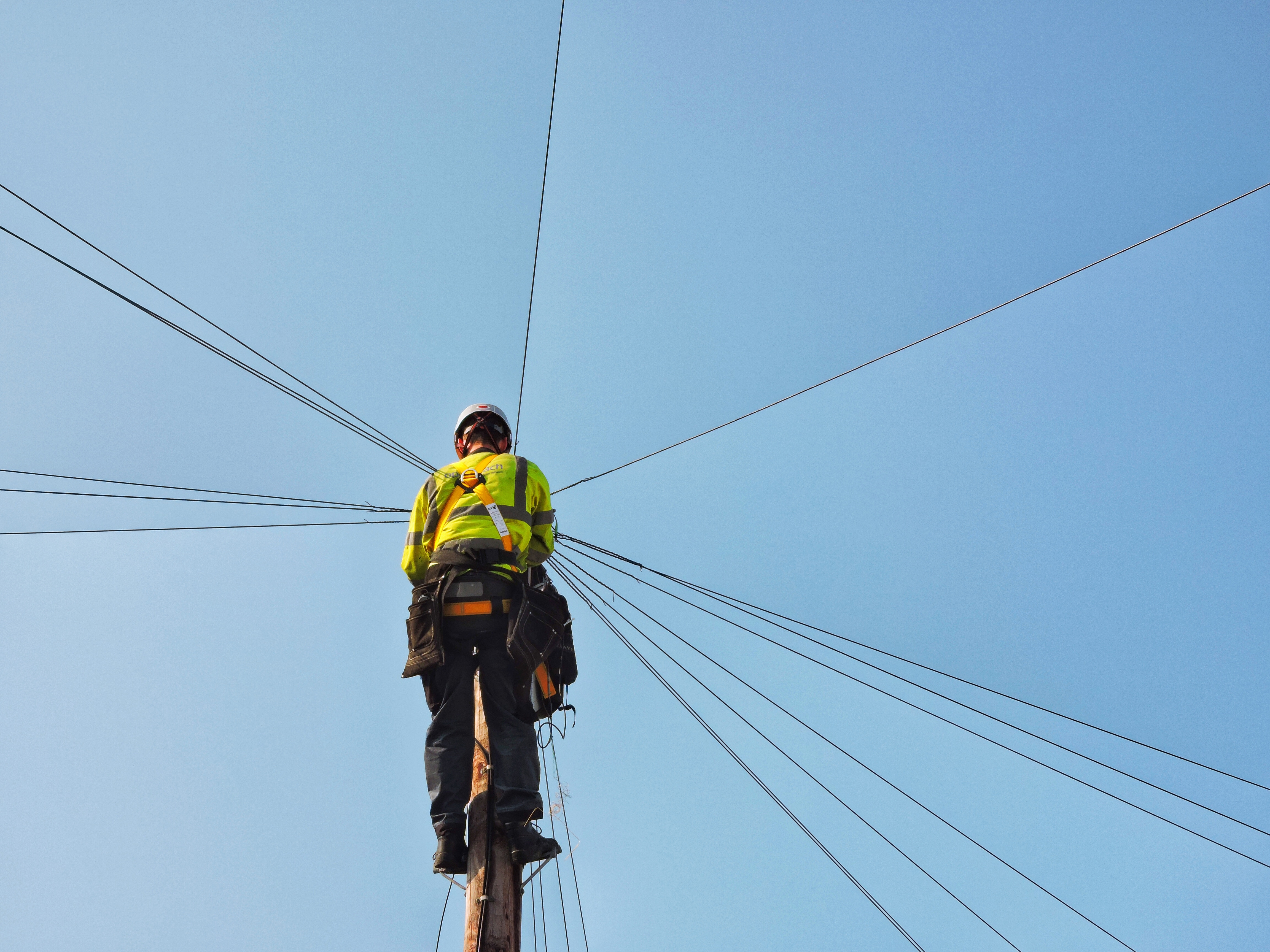 Phone Network - Telecoms Engineer working on Telegraph Pole